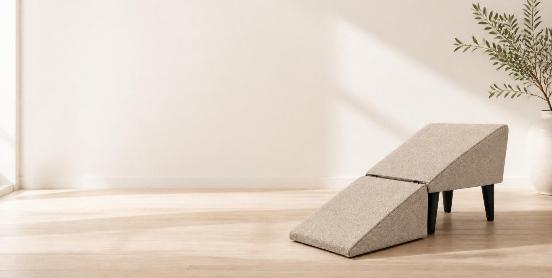 WagStep oatmeal fabric dog ramp unfolded on a light oak floor in a bright off-white room with an olive branch